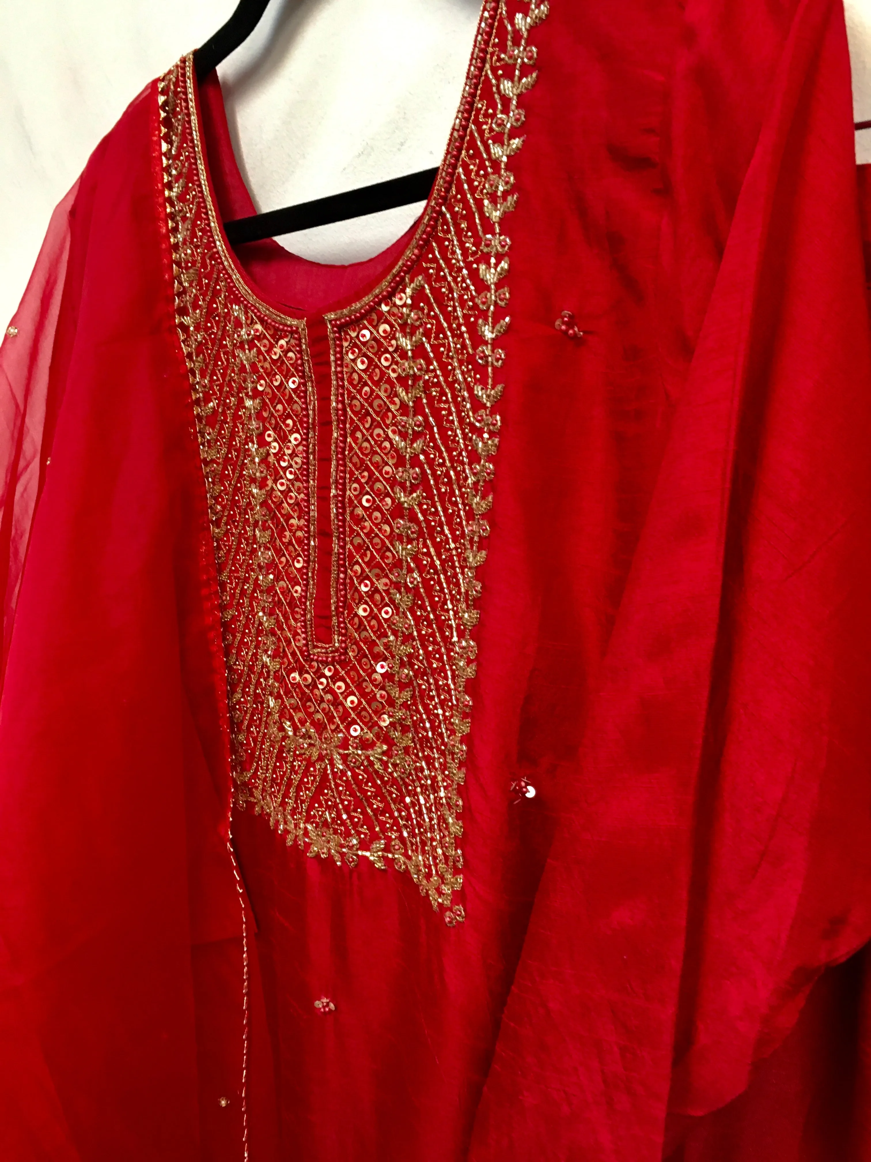 PNK003-Salwar suit with embroidery in red and yellow.