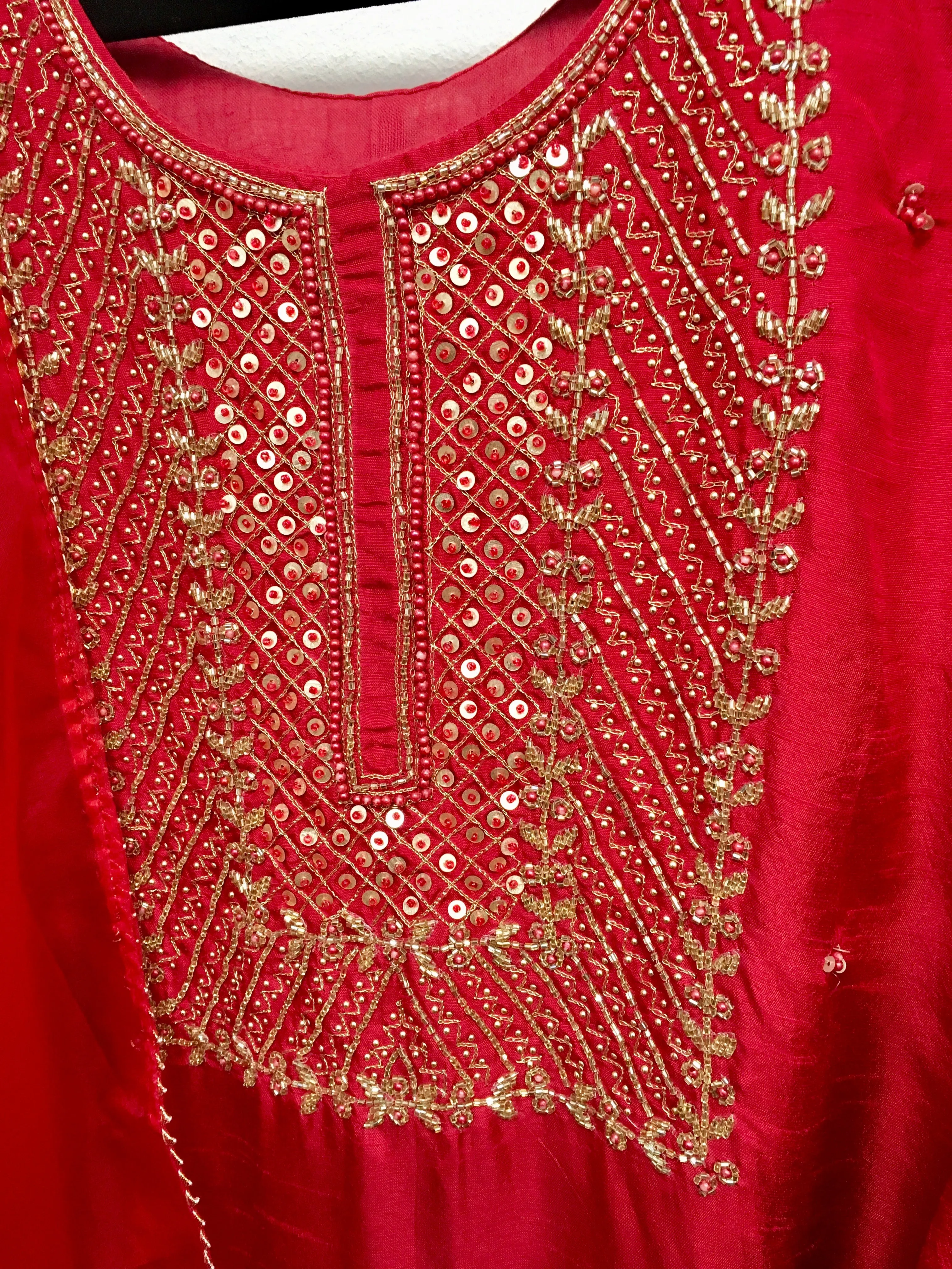 PNK003-Salwar suit with embroidery in red and yellow.